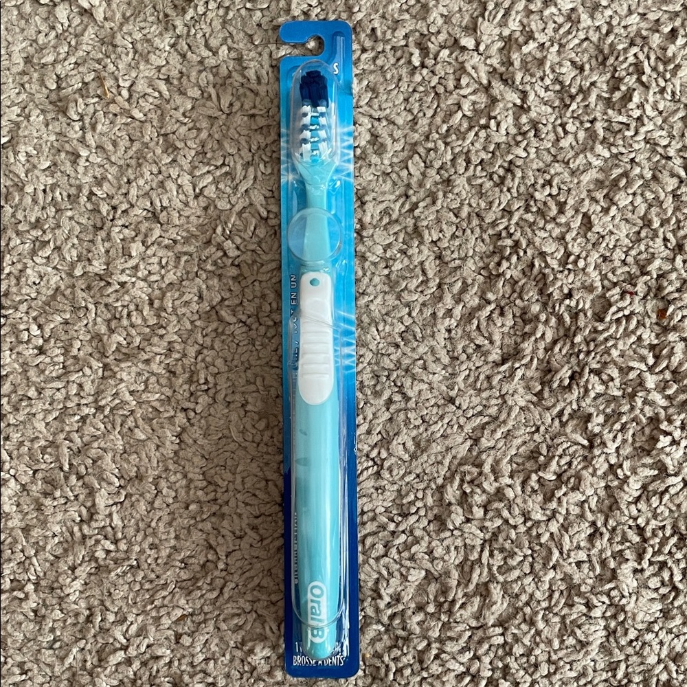 Oral B Crossaction New Blue and White Toothbrush‎